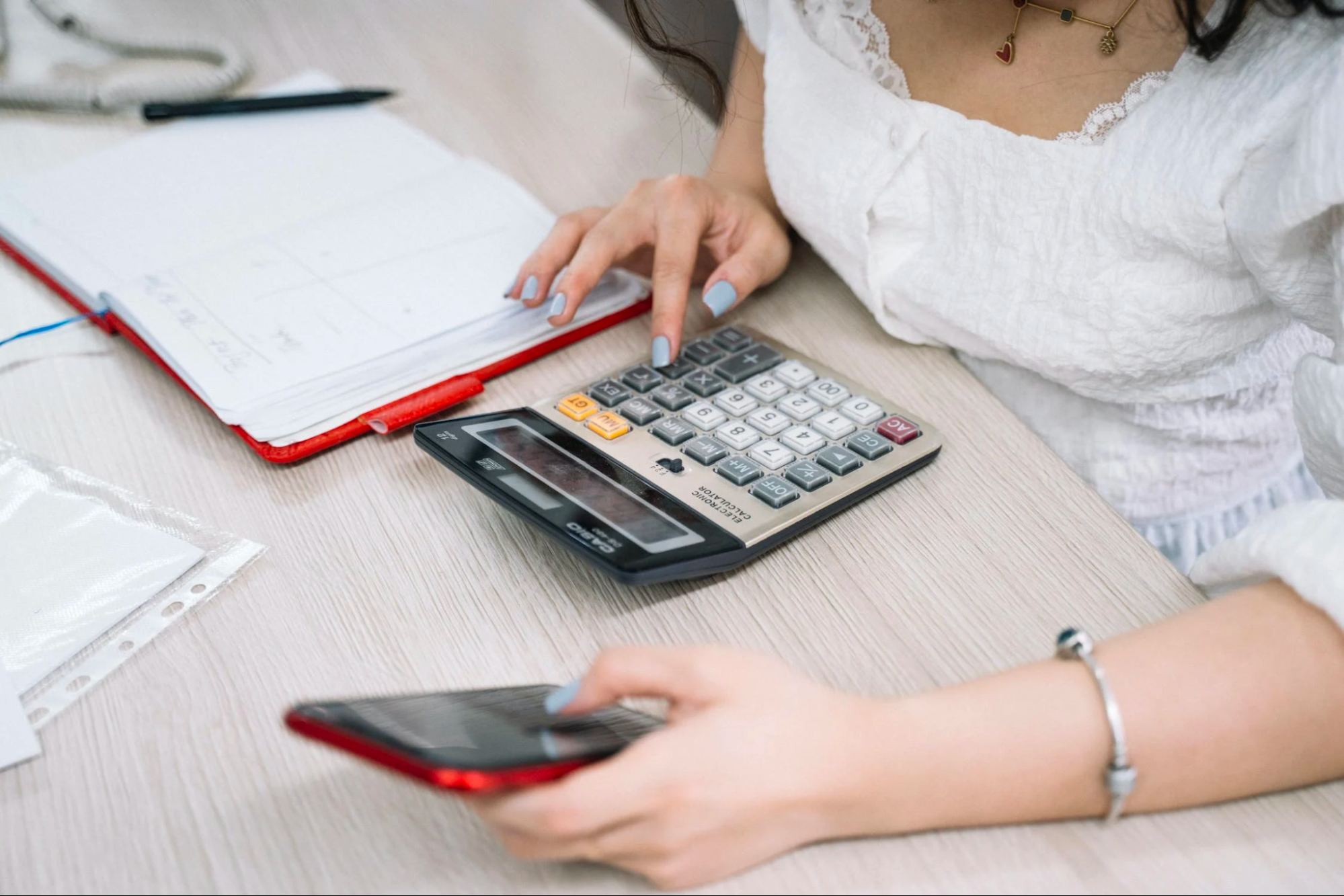 This is a photo of a person calculating the cost of divorce.
