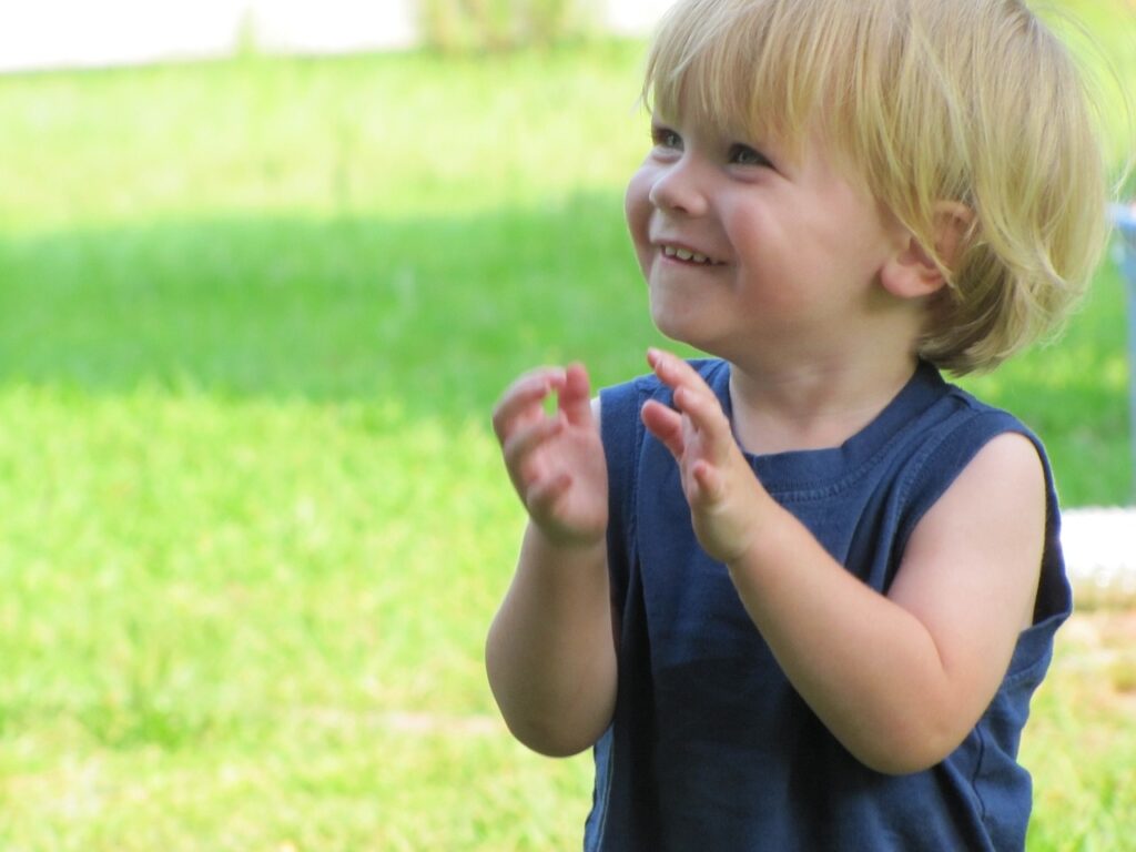 Filing Taxes as a Married but Separated Person This is an image of a child smiling outside.