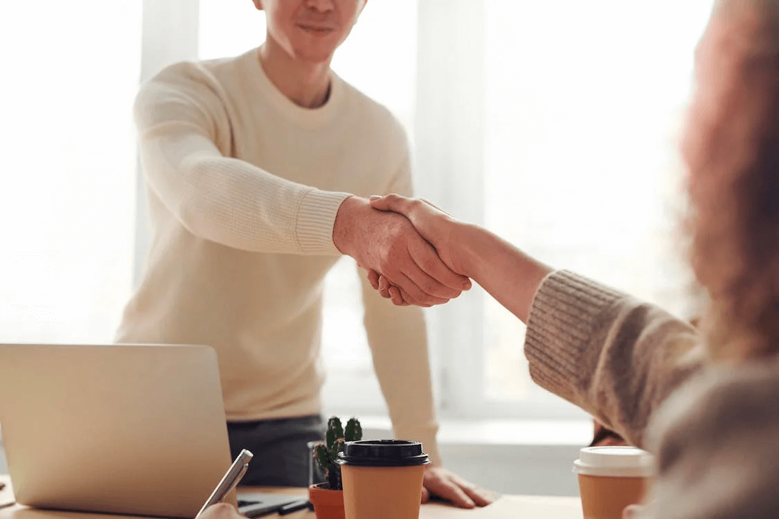 Mediation Supports Happy Families Image of a two people in a handshake