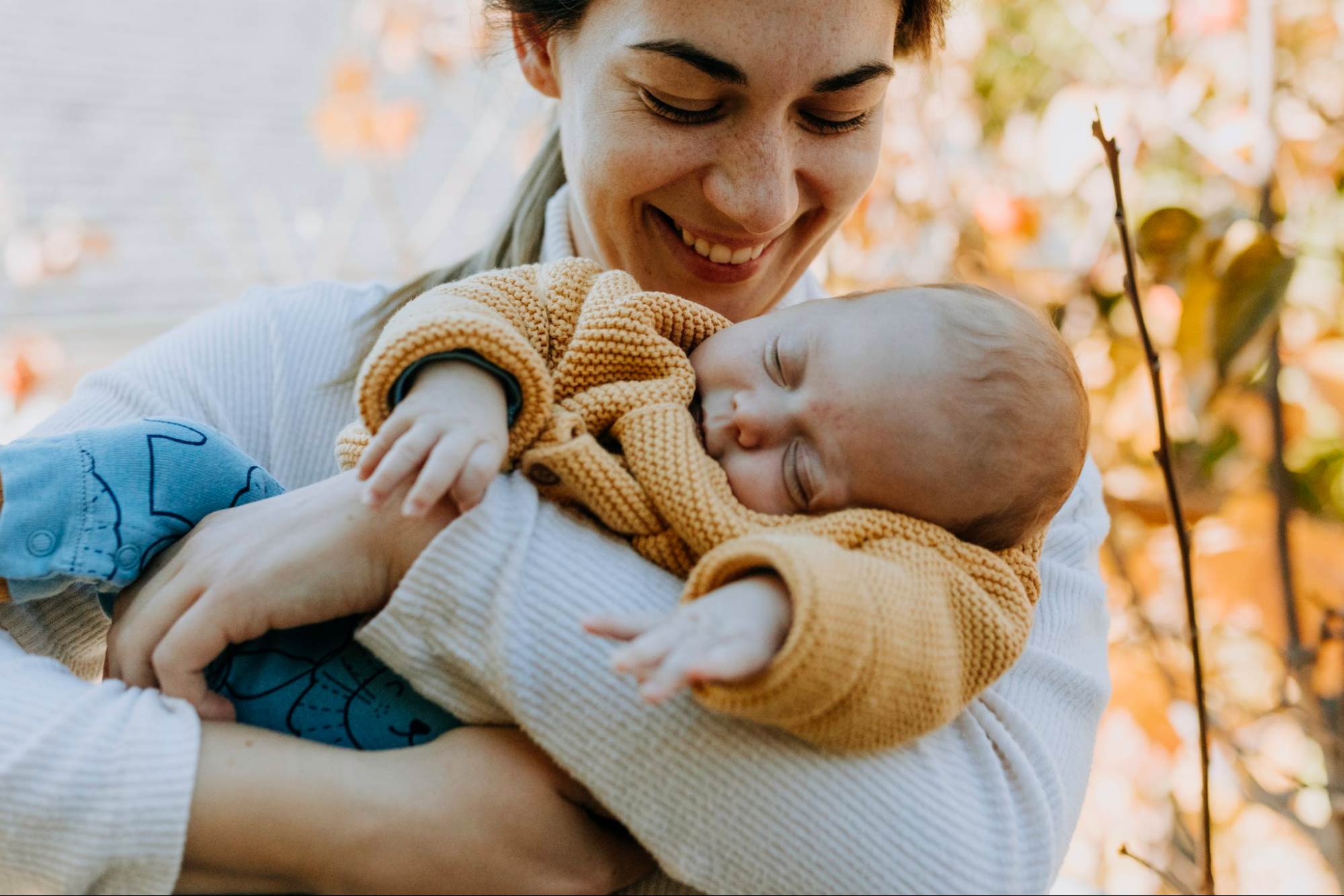 This is an image of a mother holding her child in her arms.