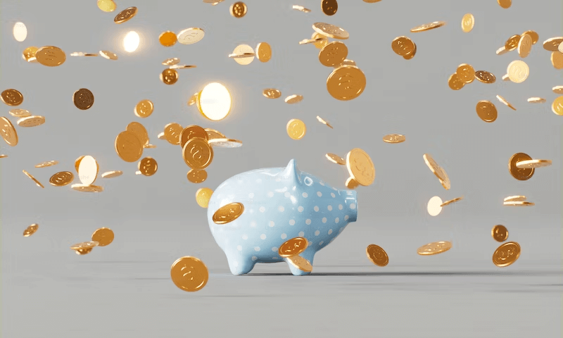 The Cost of Divorce Image of a piggy bank with gold coins falling. Cost of Divorce.