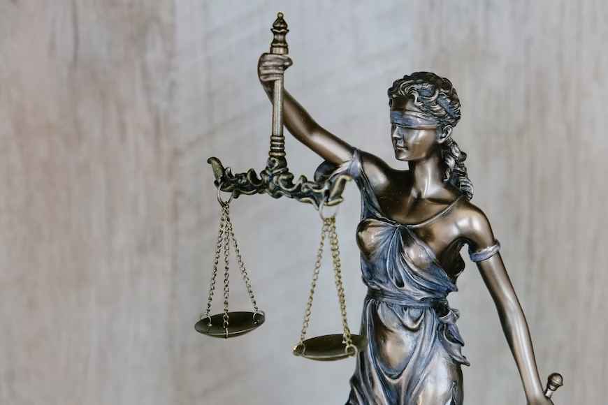 Balancing Finances in a Divorce Statue of lady justice with a scale
