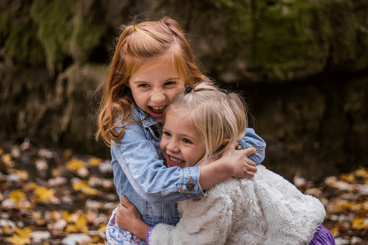 Happy outcome for stay-at-home mom divorce This is an image of two young girls hugging outside