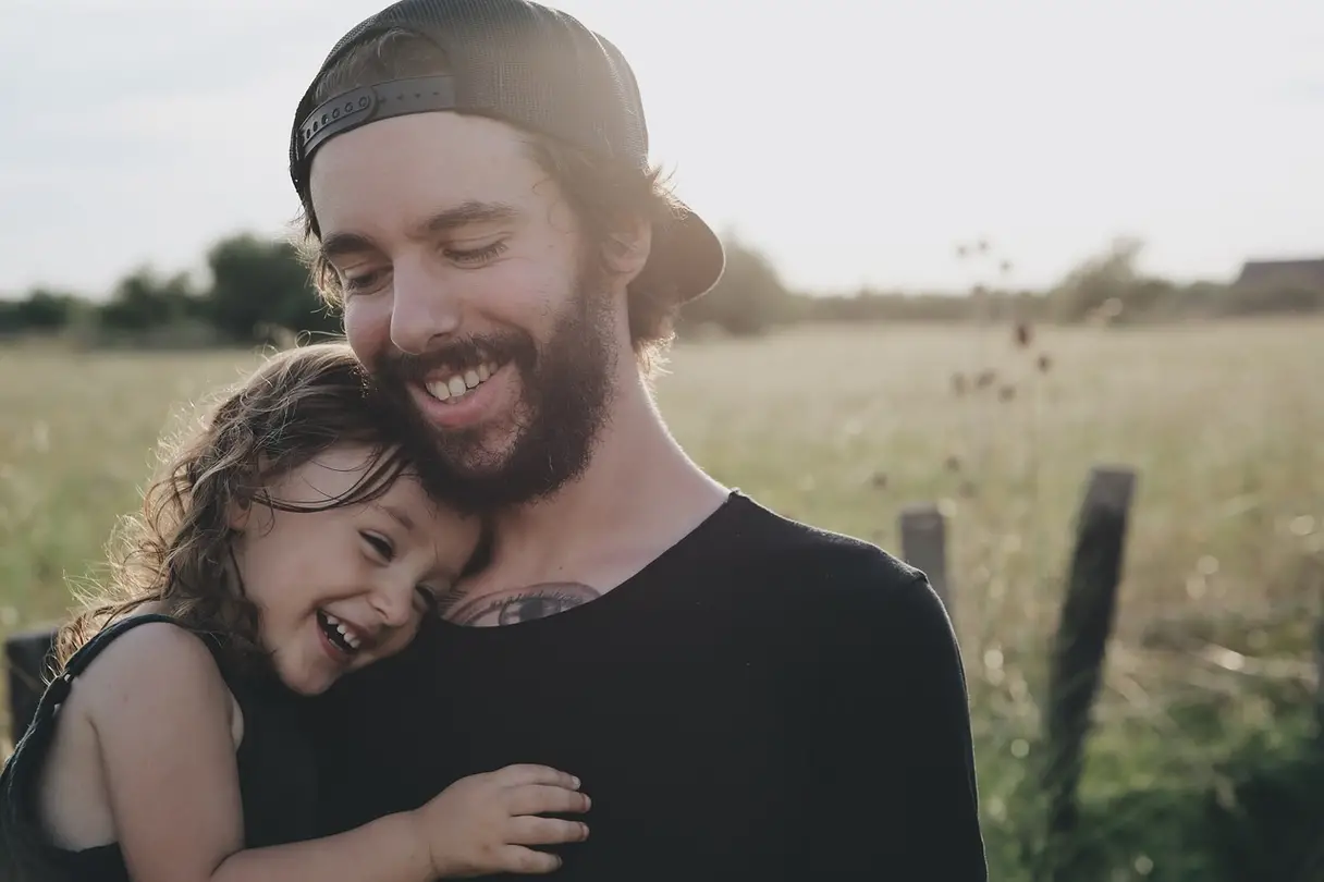 This is a photo of a father holding his daughter.