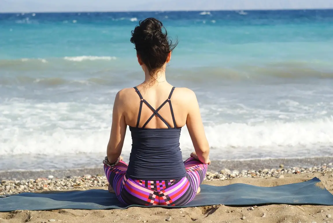 Woman sitting on the beach