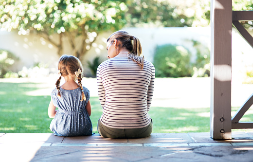 This is an image of a mother sitting with her child.