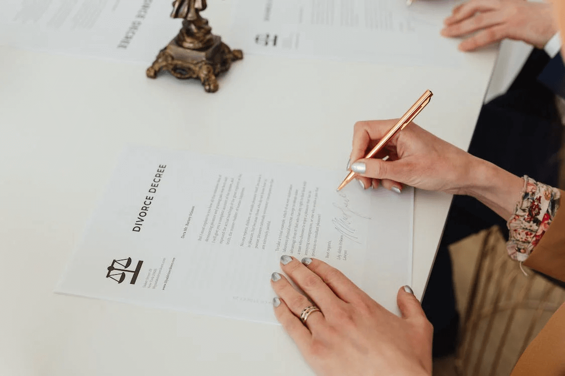 Divorce Decree Spouses sign their final divorce decree