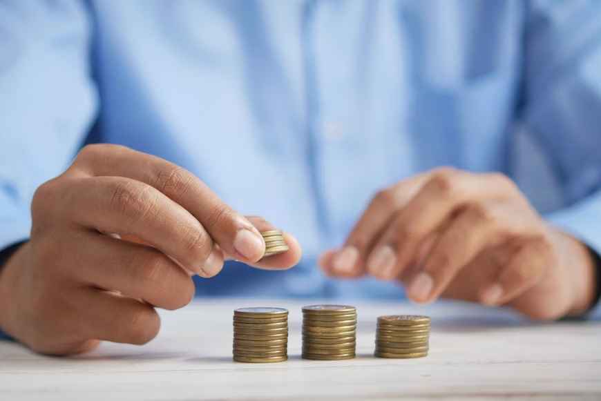 Financial Considerations During a Divorce A person stacking pennies