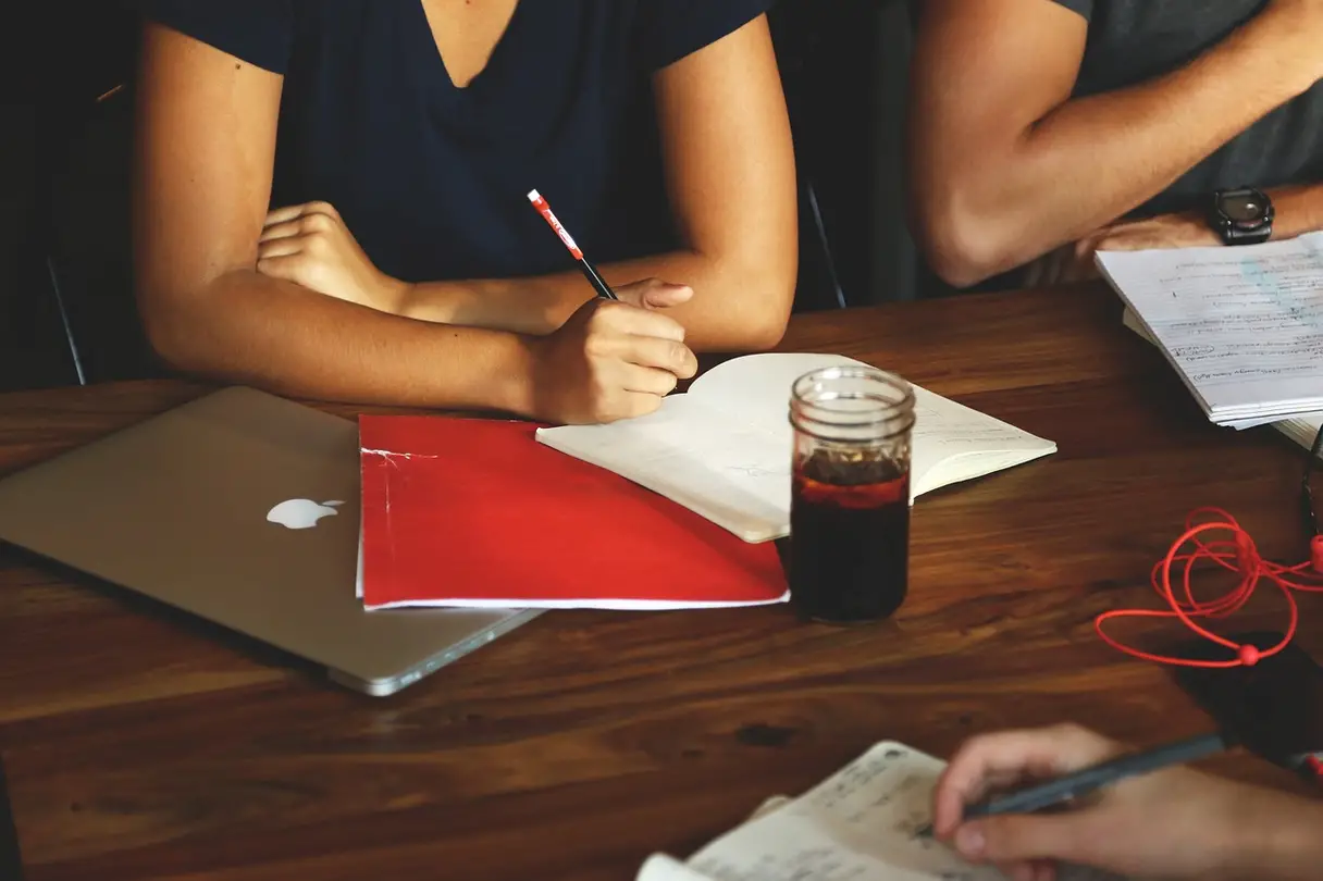 Divorce Mediation This is a picture of three people sitting at a table.
