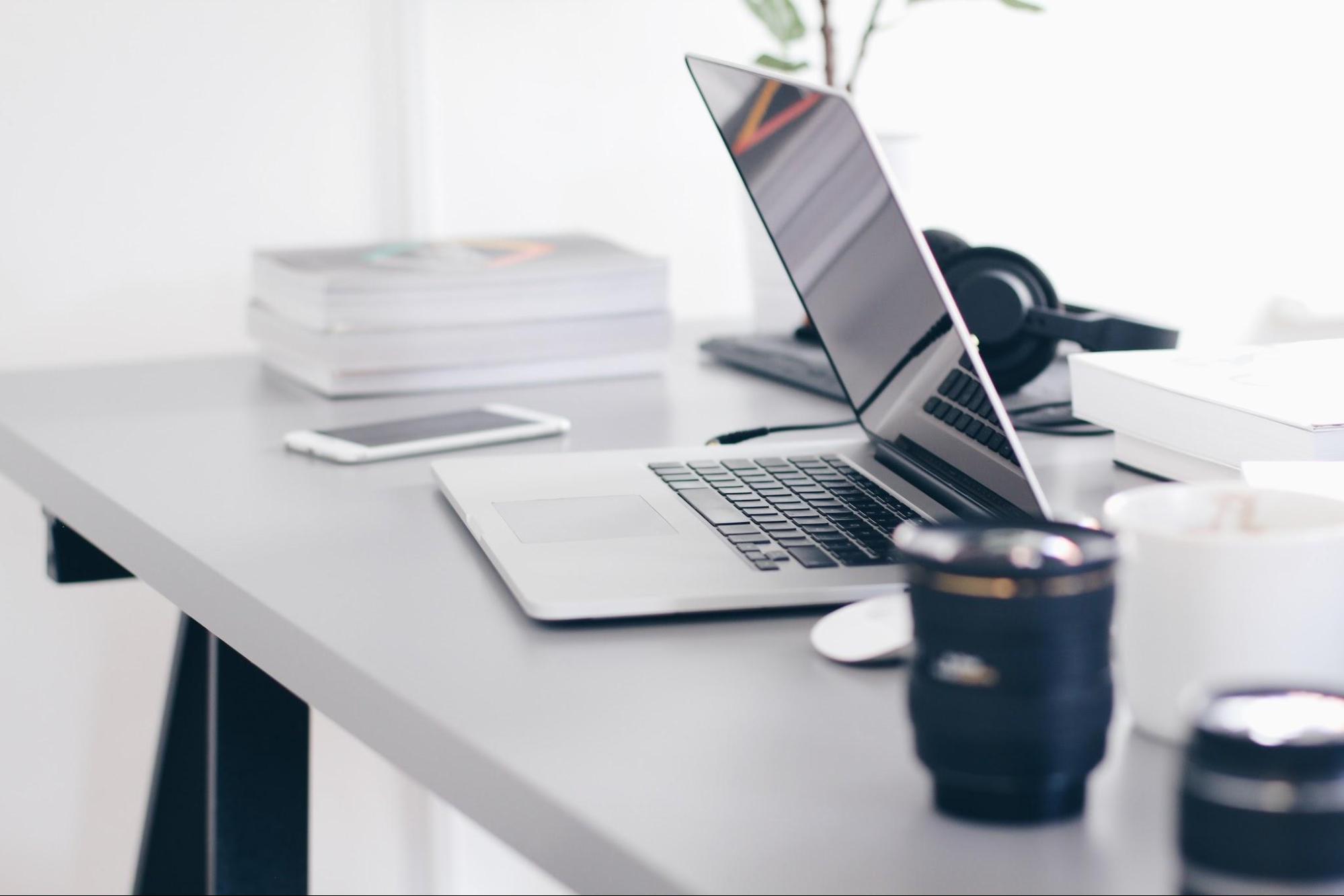 This is an image of a computer sitting half open on a desk.