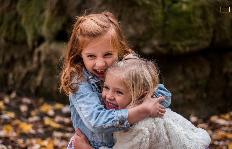 This is an image of two sisters hugging.